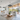 Minimalist black pendant lights in a bright open-concept kitchen and living room, offering natural warmth and modern elegance.