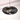 Close-up of Atomic Warm Glow Modern Pendant Light showing black elliptical wood design and warm LED bulb.
